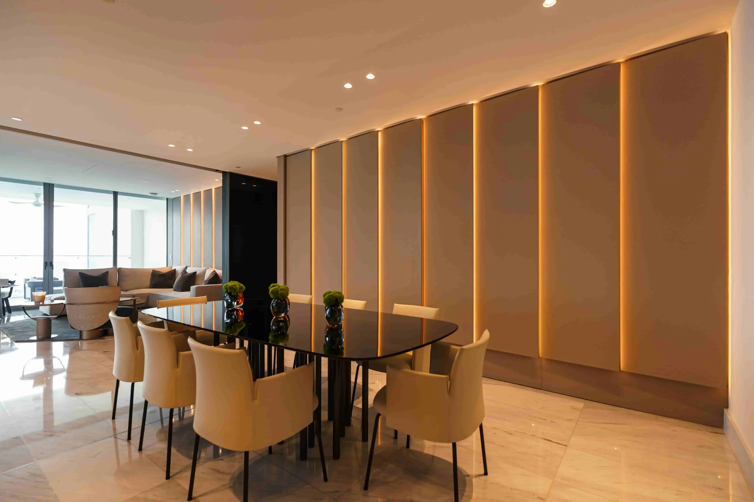 Dining room with illuminated wood paneling