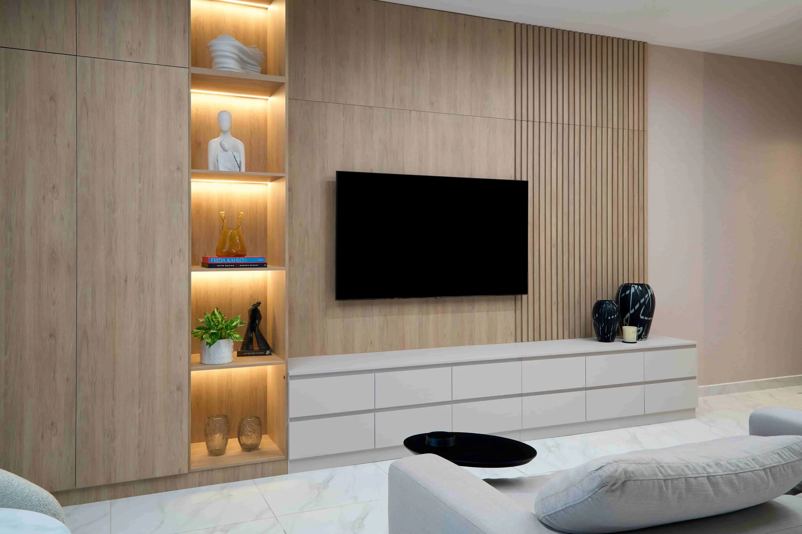 Bedroom with shelving and an entertainment wall
