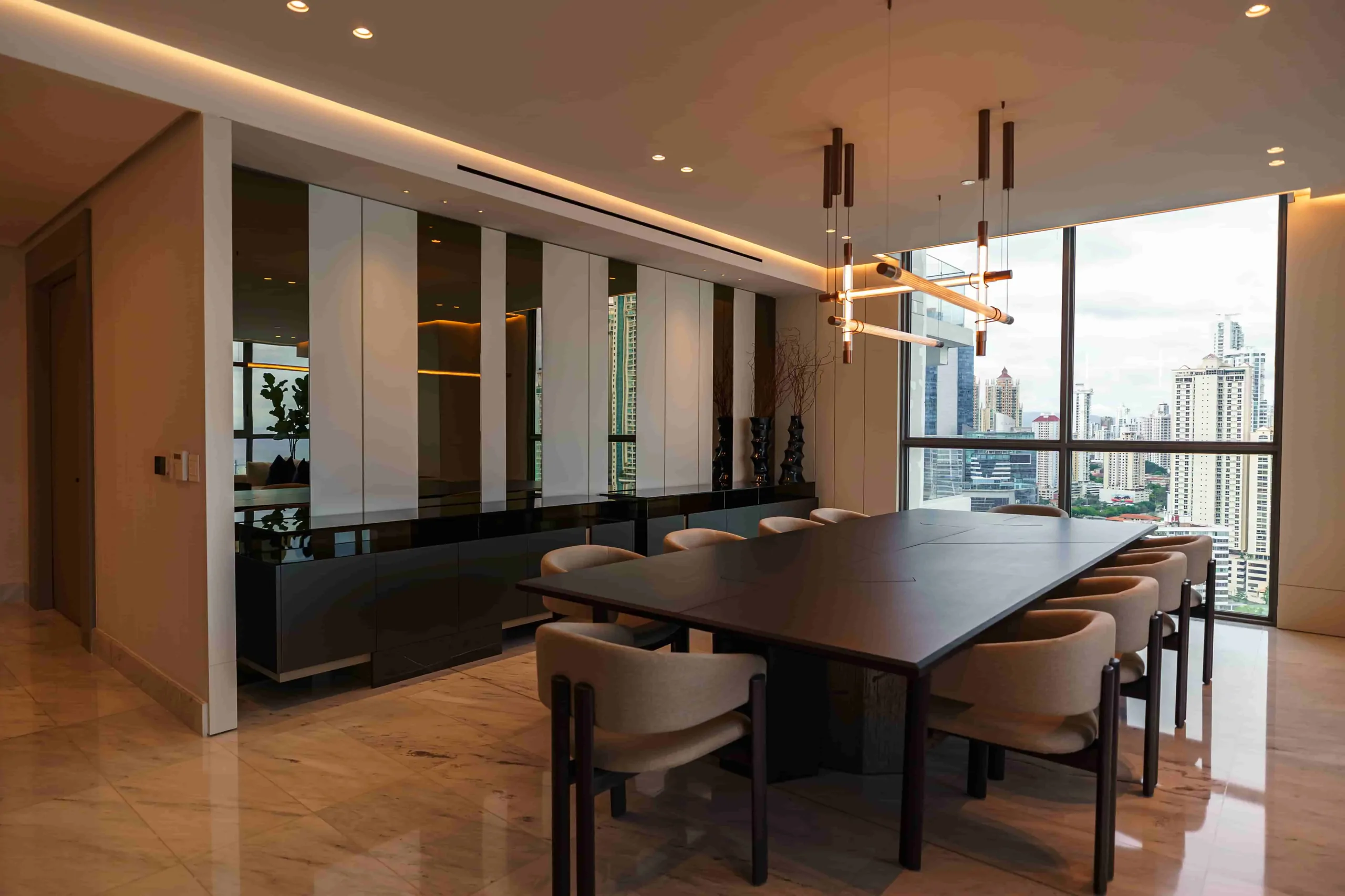 Luxury apartment dining room with a sculptural pendant light
