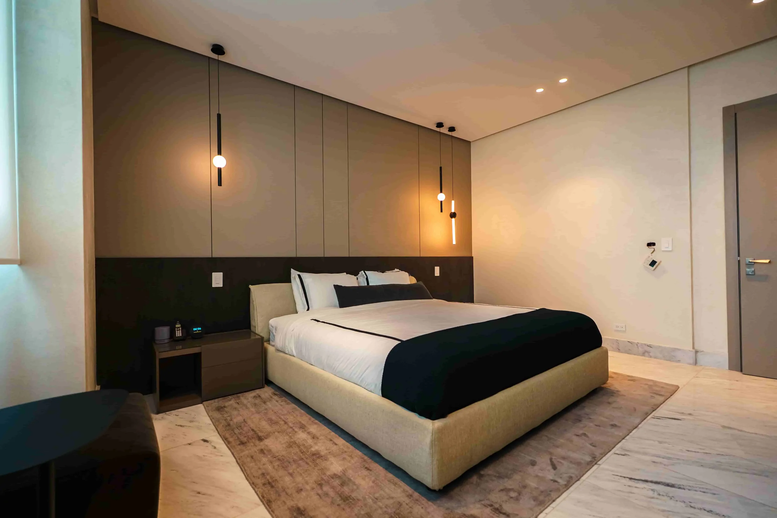 Bedroom with a wood wall and city views